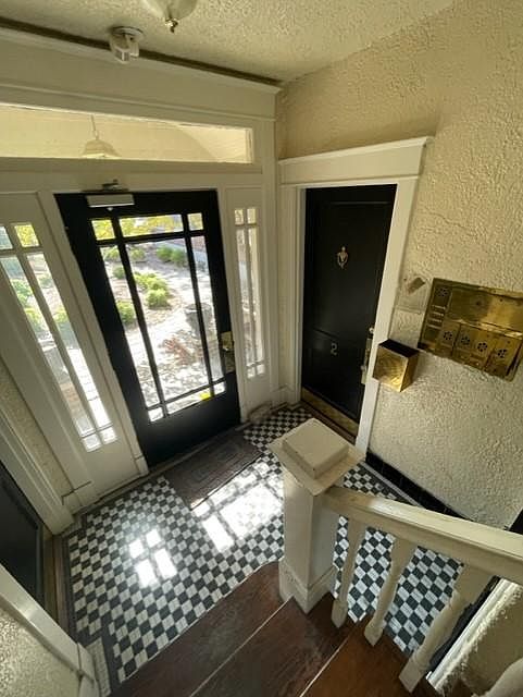 Love the black and white checked floors. Only 4 apartments per building, two up and two down. Mailboxes are right when you come in and the building is secure and requires a code or key to enter!