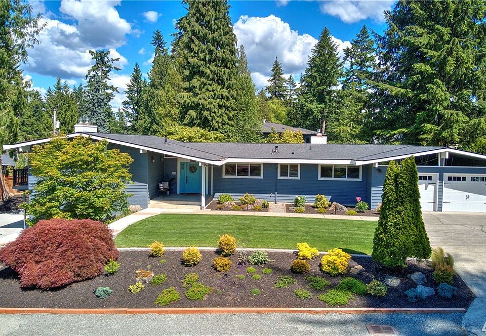 Large corner lot with great parking and an over-sized two car garage!