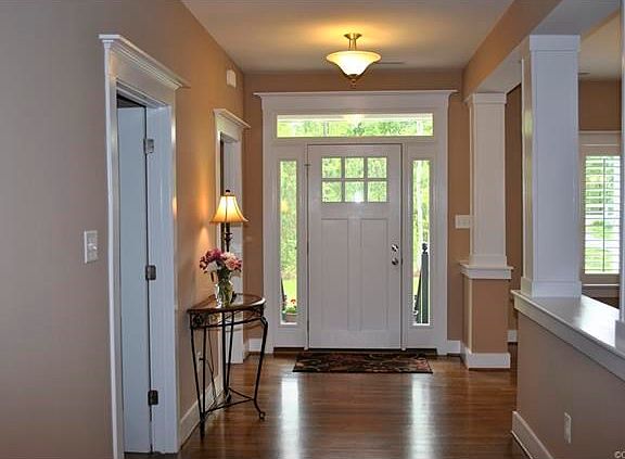 Foyer open to dining and family rooms with hardwood floors.  The first floor has 9' ceilings.