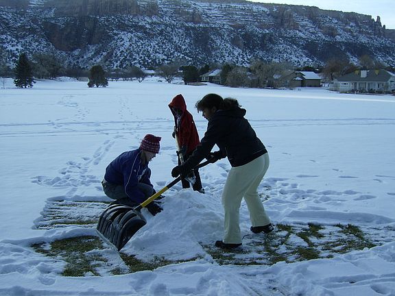 Building Snowman On The Golf Course