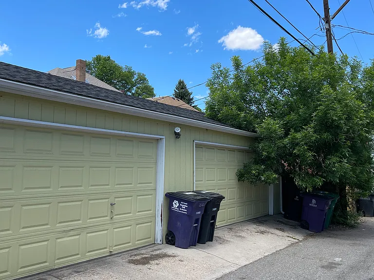 Alley access to garage (storage for garbage cans in fenced in area)