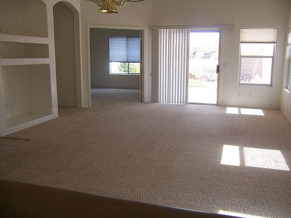 Large great room w/entertainment niche, gas fireplace, and overlooking lake.