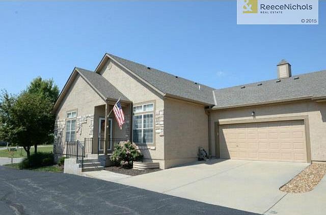 Front view with drive off of private street. Two car garage!