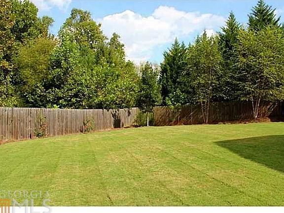 Exquisite yard, level, grassy and private.