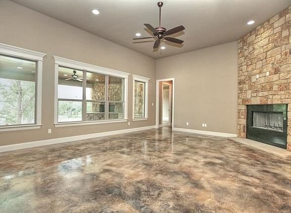 Open Living Room is magnificent as you look out the windows and see lush Heritage Oak trees.