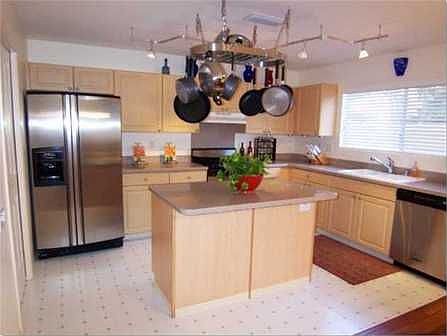 Well appointed kitchen features stainless steel appliances