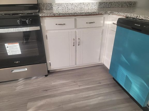 Enjoy cooking in a fully updated kitchen featuring a brand new stove, sleek new dishwasher, and stunning granite countertops. The space is accented by beautiful new flooring that adds a fresh, modern touch to this inviting home.