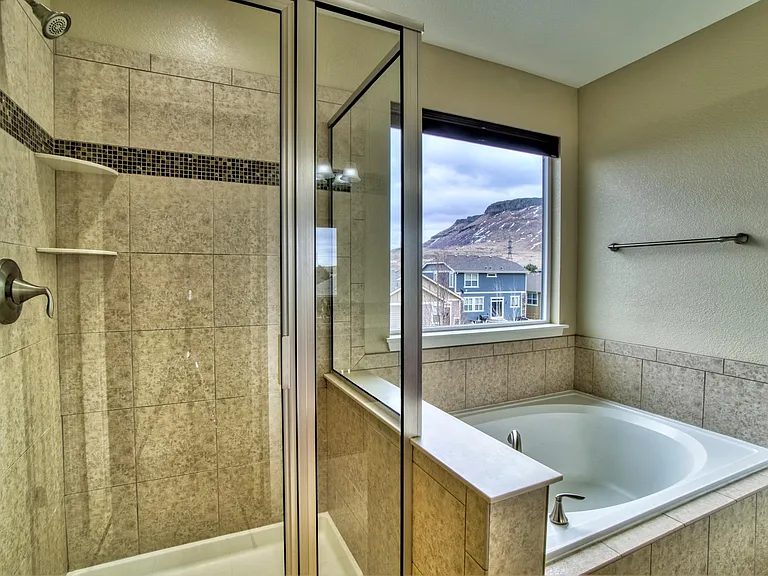Upper level - 5-piece master bathroom with view of North Table Mountain (10' x 9').