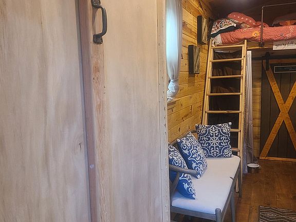 Wood cabinet with drop down murphy bed on remote control/sofa/loft bed for 2/ bathroom with barn door/ wood floors