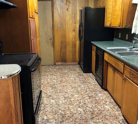 Kitchen with appliances including Refrigerator