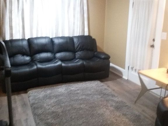Living room w/ Perrigo Floor