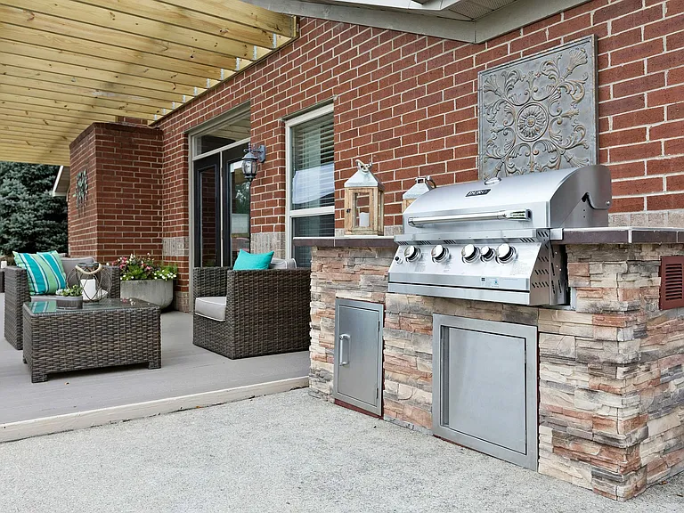 Fire up the grill and bring dinner outside _ this patio is perfect for casual cookouts.