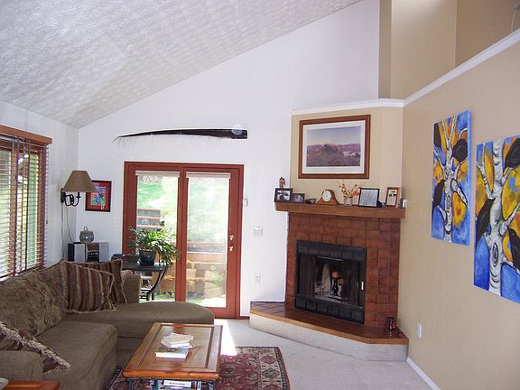 Vaulted Ceiling and Cozy Fireplace in the Living Room