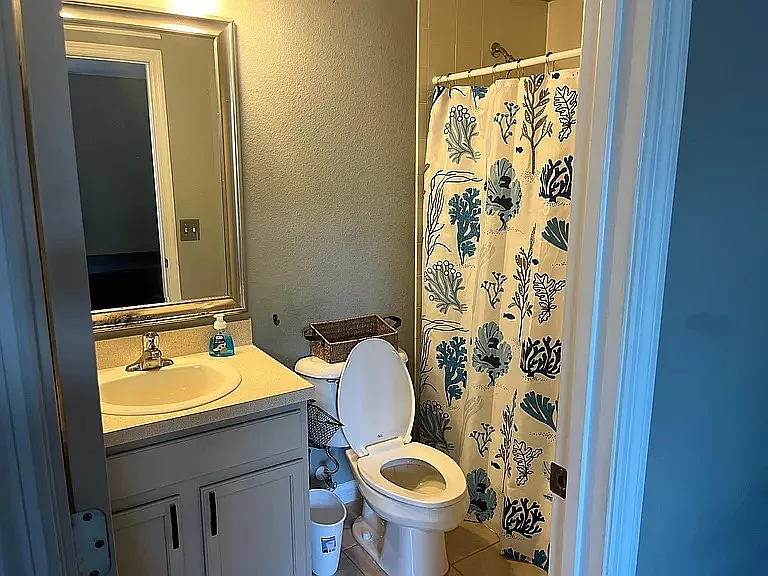 Second bedroom bathroom that has tub