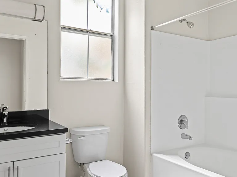 Bathroom with Bathtub and Cabinet Storage