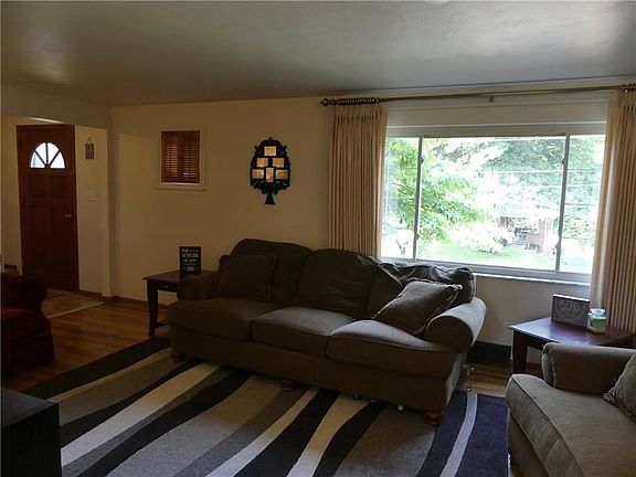Another view of the living room.  The windows in this home are trimmed with marble sills fill the home with warm natural light.