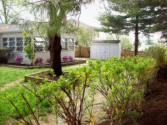backyard view and sunroom in rear