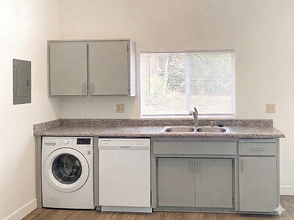 Kitchen with dishwasher and washer hook up