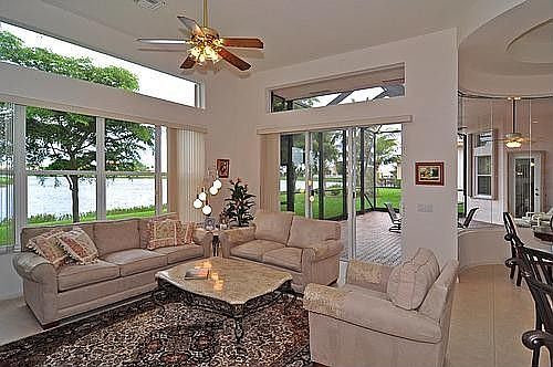 TILED FAMILY ROOM OVERLOOKING LAKE AND PATIO