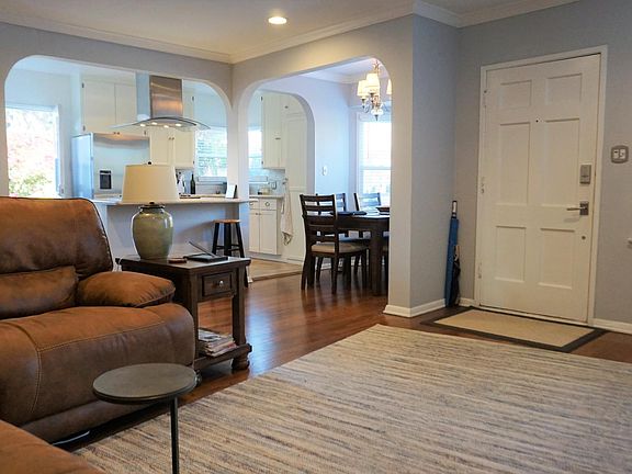 Open floor plan with living room, dining room, and kitchen.