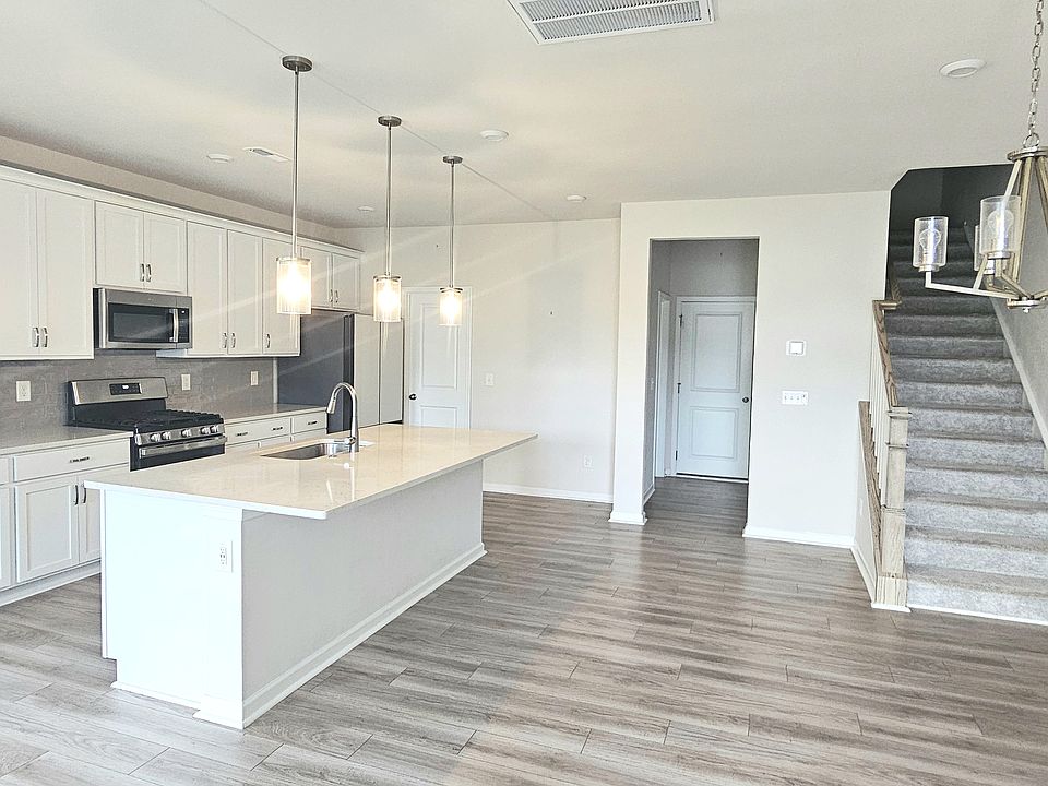 Living, dining and kitchen area