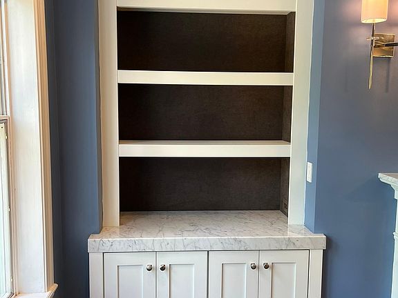 Built-in cabinet with baseboard drawers