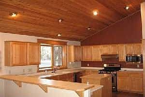 Open kitchen with new appliances and paint