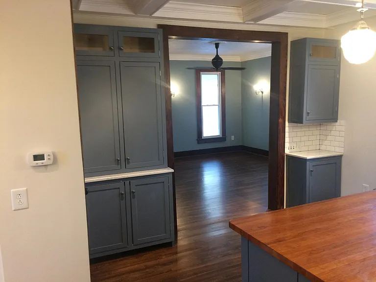looking from kitchen into the family room, pantry and extra storage.