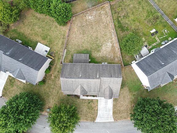 Aerial view of property with backyard