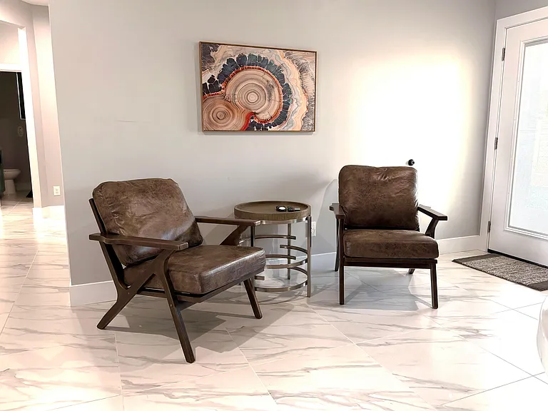 Sitting area. Extra seating and lounge area near TV and kitchen