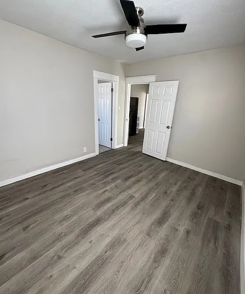 View from back of the bedroom. Second door to the left is the restroom