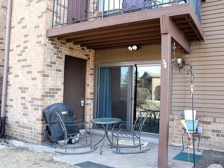 Porch / easy access to move things in being on the bottom floor! Steps away from the swimming pool. 
There is also a backdoor entrance