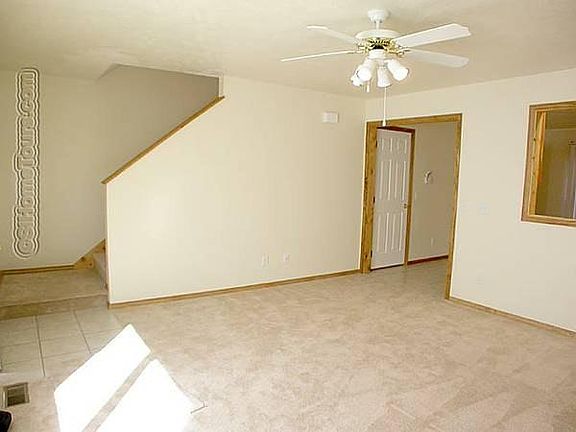 Living room space with ceiling fan!