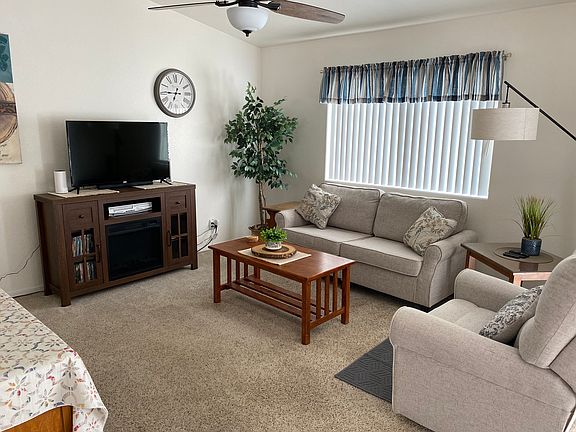 Newer Furnishings. Rocker Recliner, Sofa, TV Console with Electric Fireplace, DVD Library/Player, Flat Screen ROKU Smart TV with Internet.