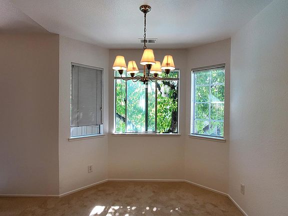 Dining room overlooking pool and lawn