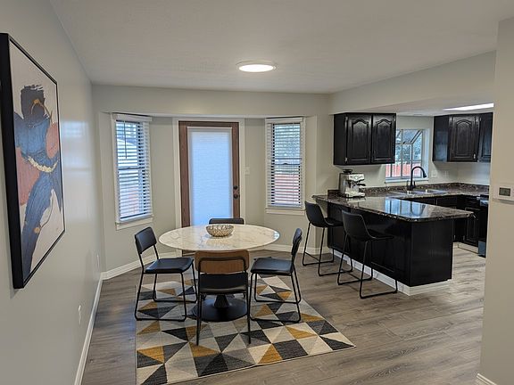 Kitchen and Dining Area. All new paint, blinds and trim. a