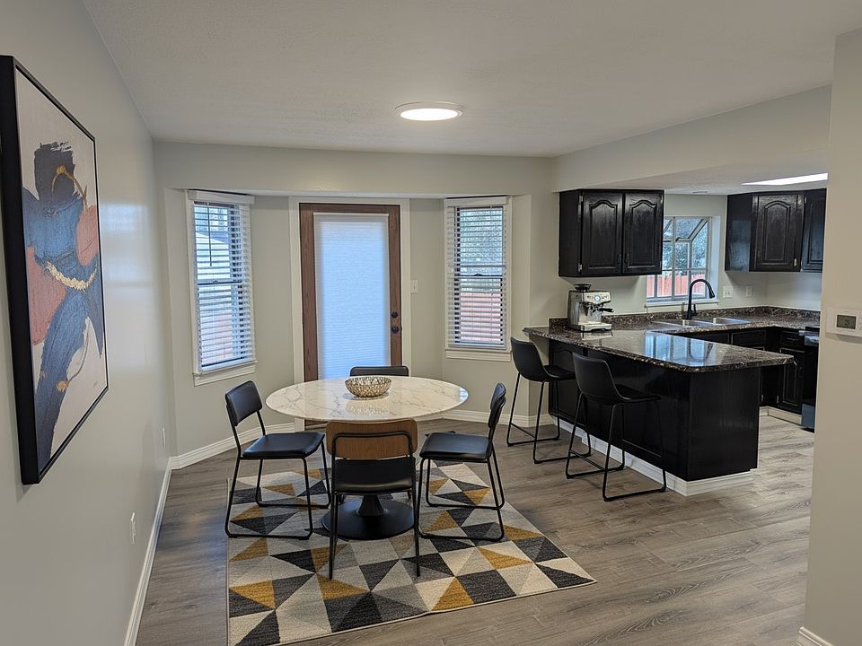 Kitchen and Dining Area. All new paint, blinds and trim. a