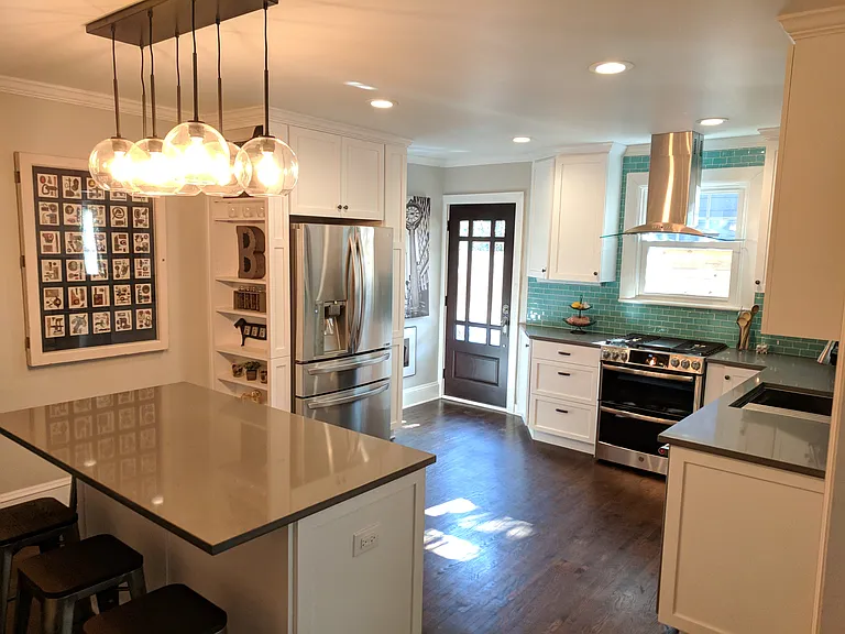 Kitchen showing side yard door