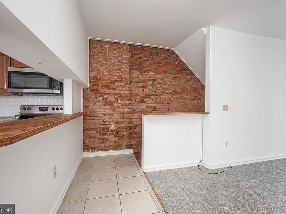 stairway to downstairs, laundry and storage