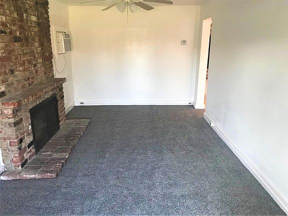 Living room with grand fireplace.