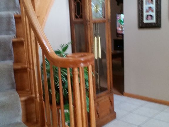 Curved Oak Stairs in Foyer