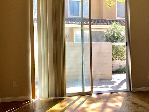 Living area with a sliding door to the front courtyard.
