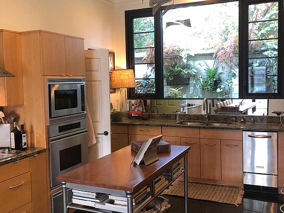 Kitchen with granite countertops and floors.