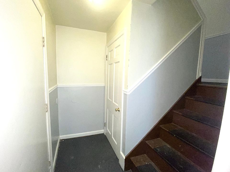 Stairwell to other unit and basement where you_ll find your laundry and private storage