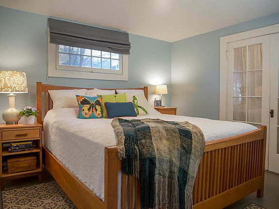 Master bedroom with small sitting room/office behind french doors