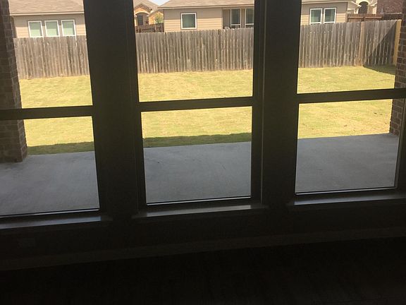 Looking into the back yard. Windows now have 2" blinds