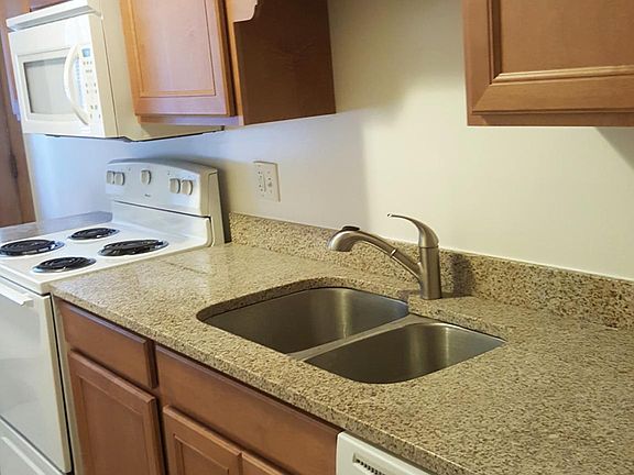 Kitchen has self closing cabinet doors