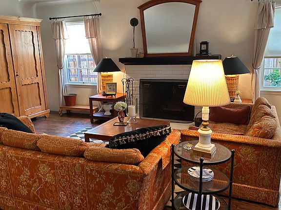 Living room with wood burning fireplace