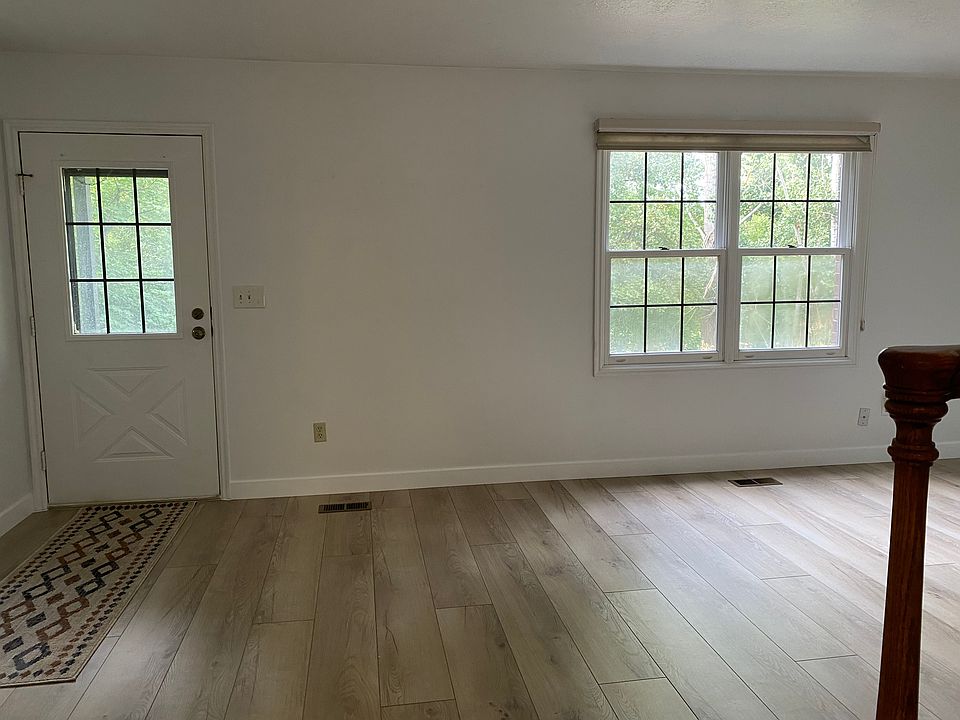 Front room window and door from bottom of stairs.