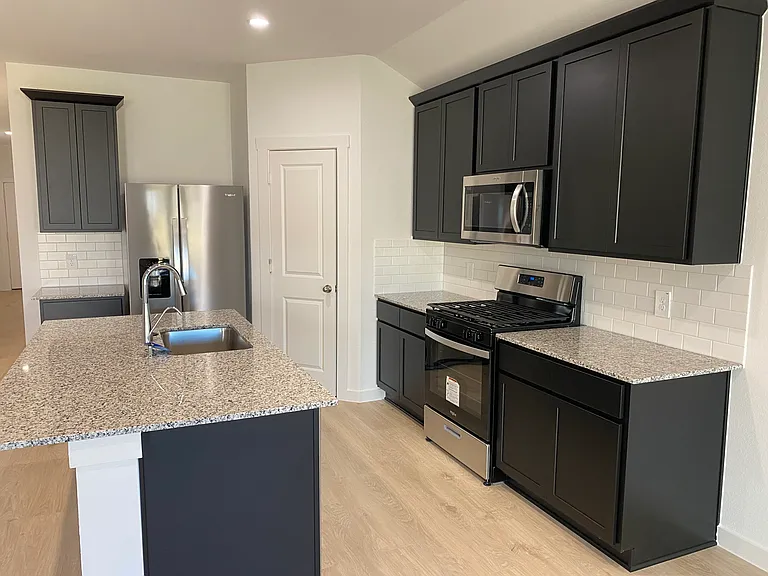 Brand new appliances in the kitchen. Large kitchen island perfect for chatting with the chef, casual breakfasts, enjoying appetizers, and more!